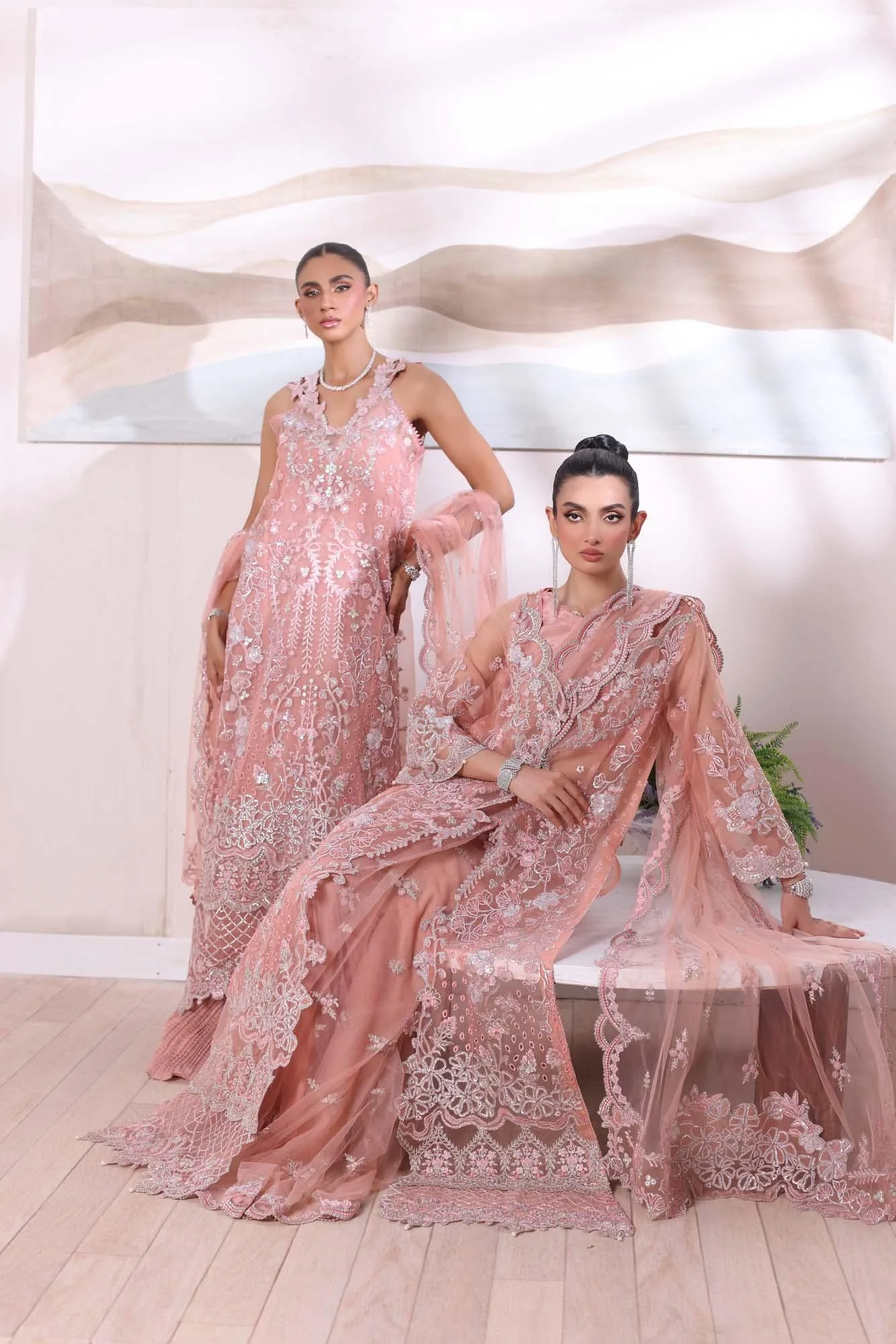 Pastel pink formal lehnga set with silk shirt, crushed lehnga and embroidered net dupatta – view 1 – Poshaq
