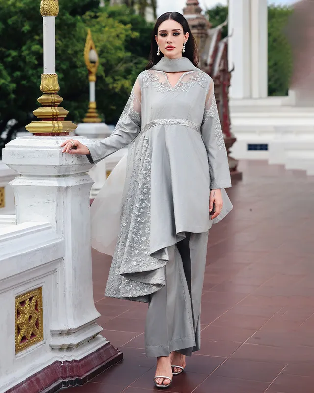 Grey raw silk three‑piece suit with organza dupatta and sequin‑embellished peplum – view 1 – Poshaq