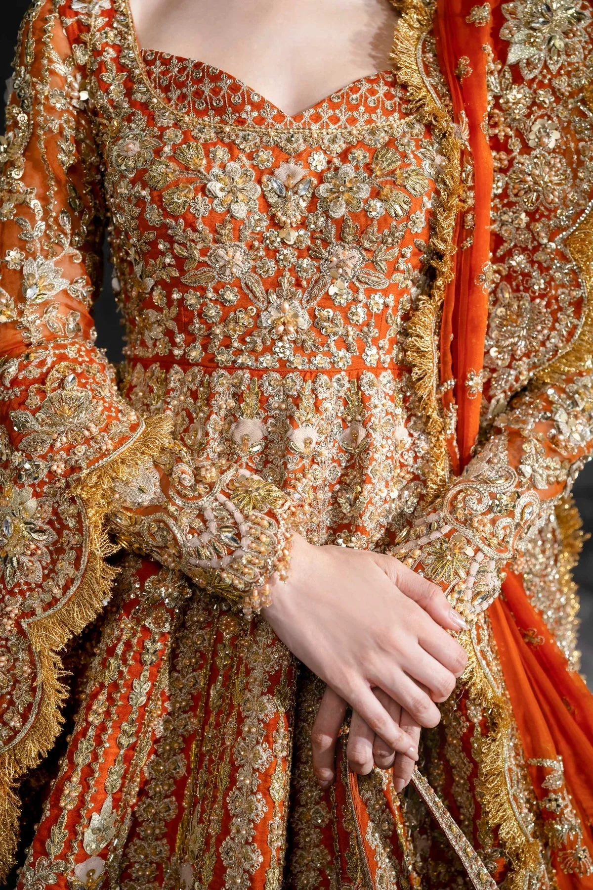 Vibrant Tangerine bridal lehenga with gold embroidery and full sleeves – view 5 – Poshaq