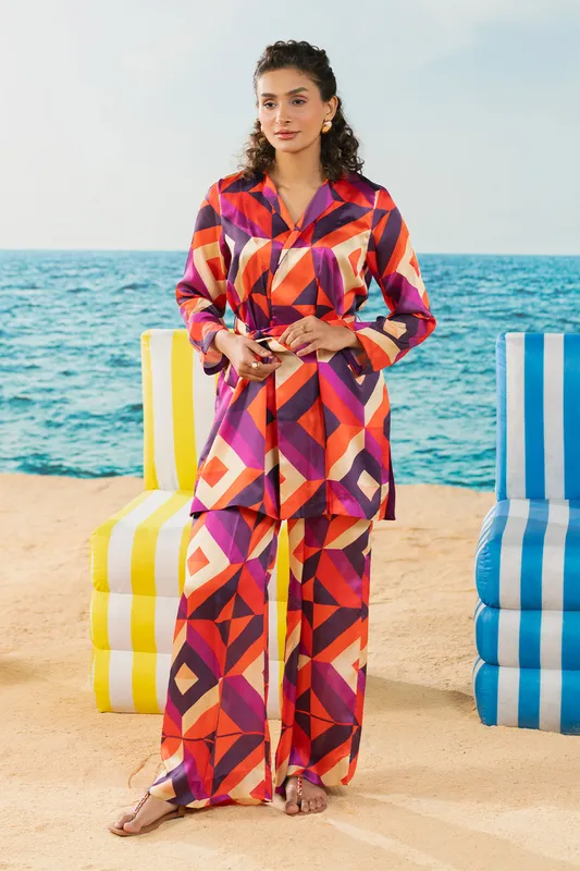 Orange silk shirt‑style top and straight pants set with vibrant colour – view 1 – Poshaq