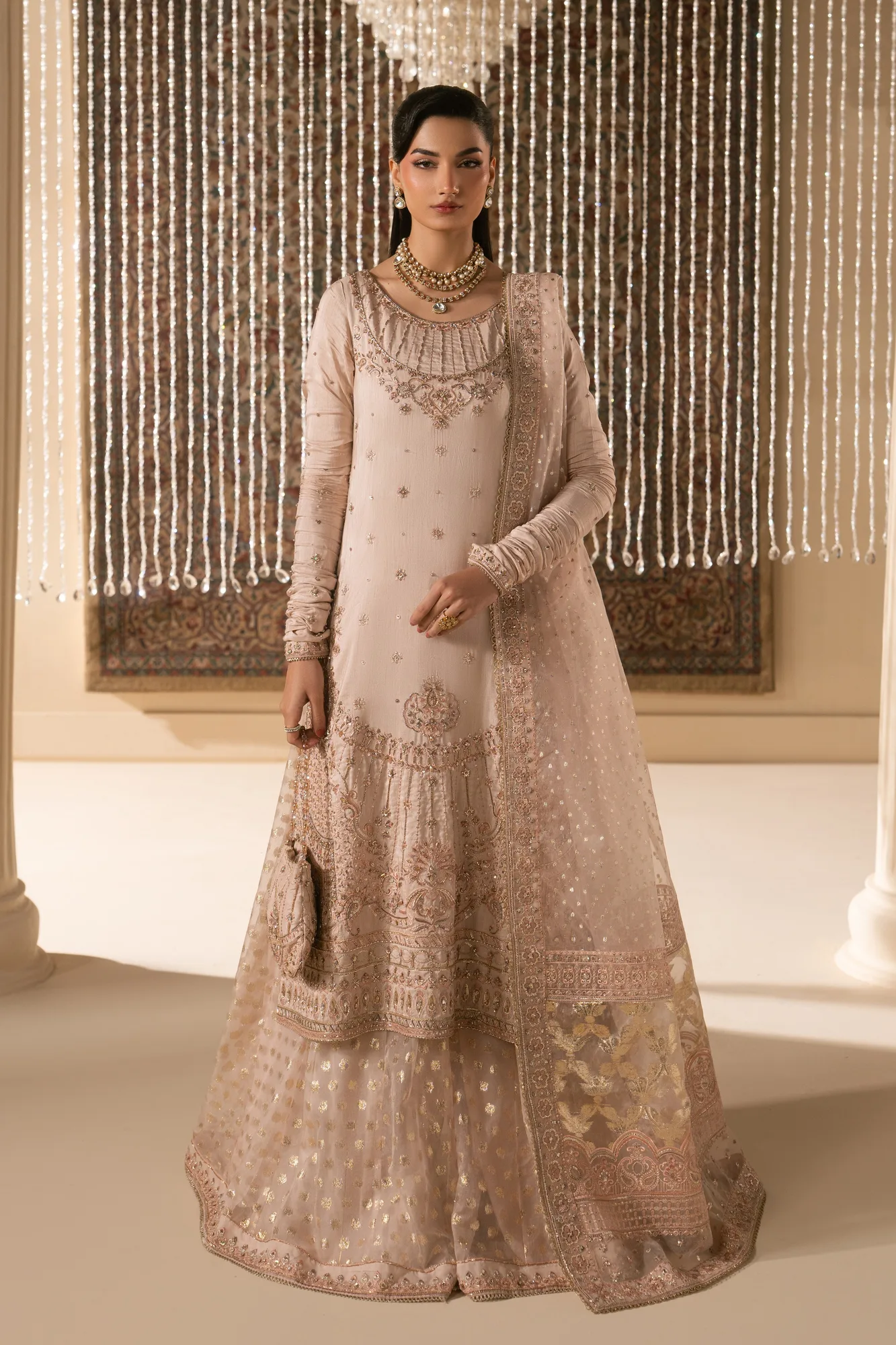 Pink formal outfit with silk shirt, organza sharara, dupatta and raw silk pouch – view 1 – Poshaq