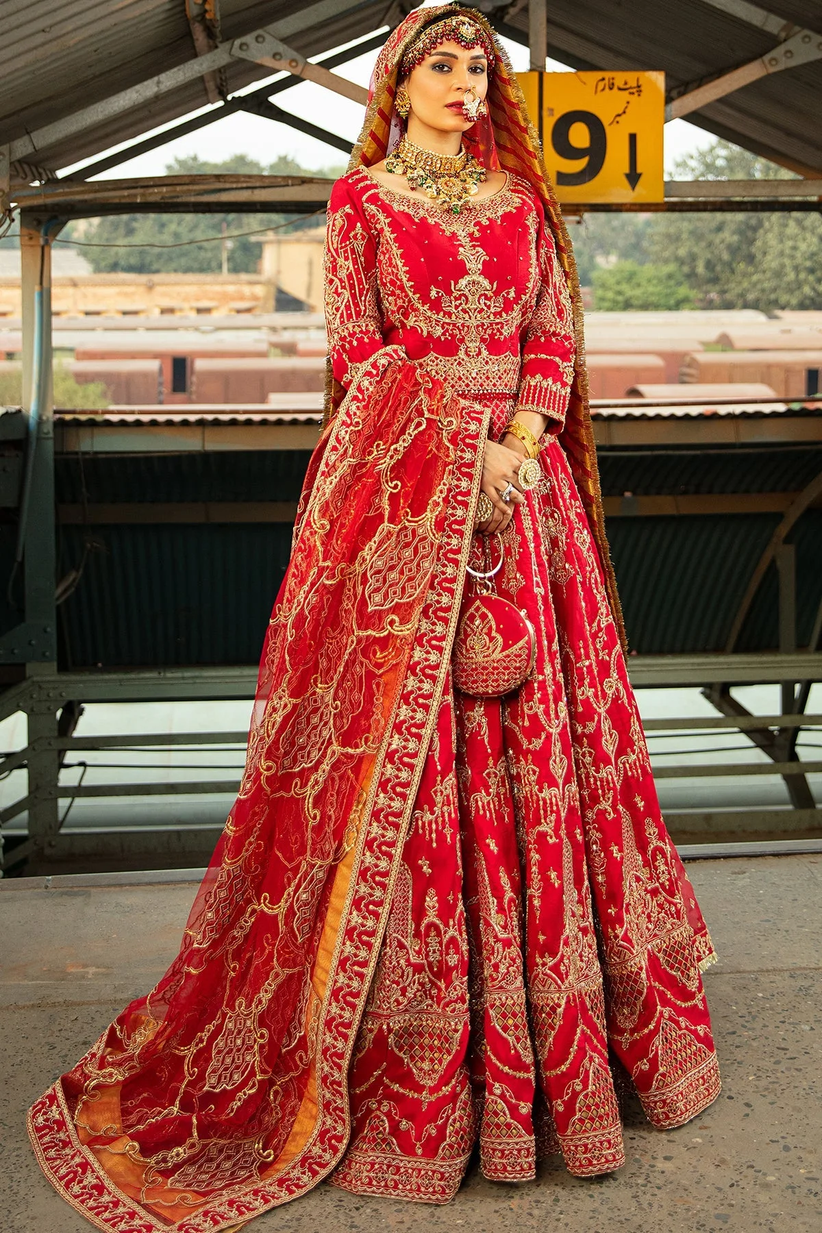 Red formal lehenga with intricate embroidery and structured choli – view 1 – Poshaq