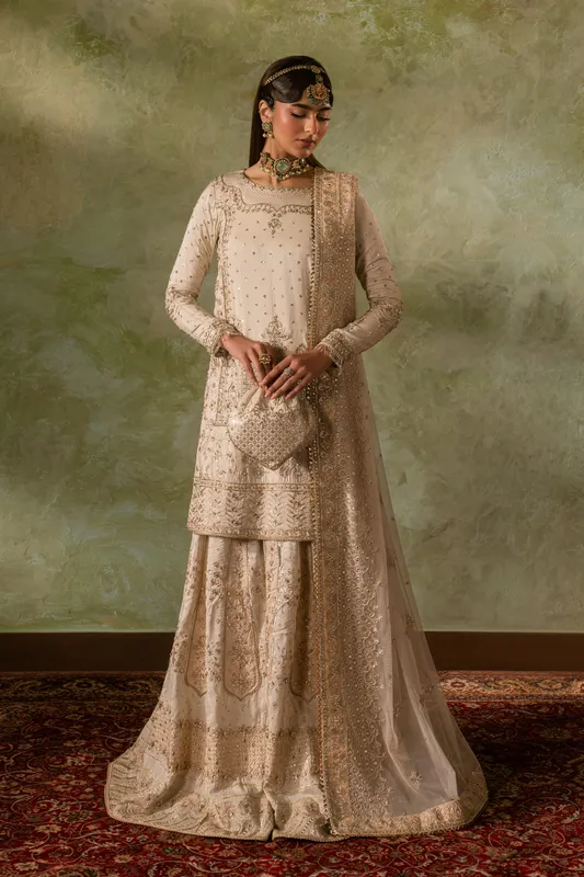 White formal four‑piece suit with raw silk shirt, silk sharara and net dupatta – view 1 – Poshaq
